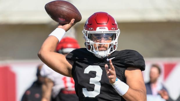 Freshman quarterback Malachi Singleton warms up during spring practice for the Arkansas Razorbacks.
